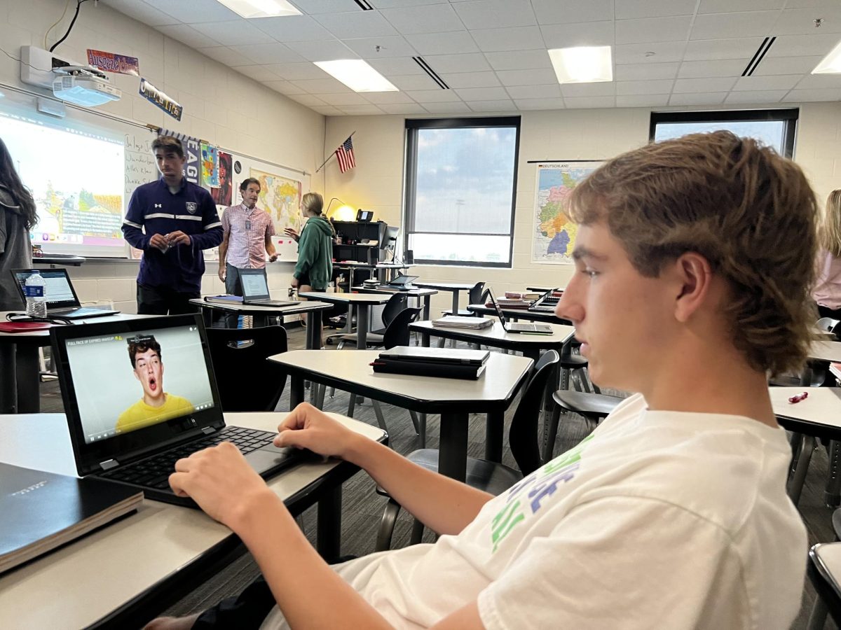 Senior Gavin Epper sitting in Early Bird Journalism waiting for class to resume. Im exited to learn more about journalism as well as getting to cover current New Ulm High School events, said Gavin Epper. The class of Journalism is learning how to post on the NUHS Eagles site.