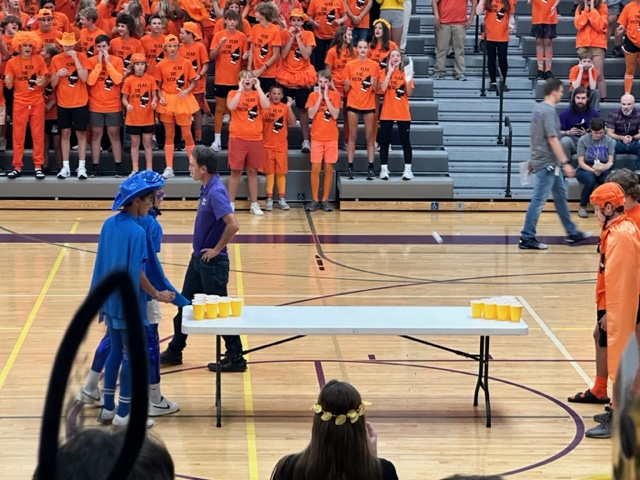 Two sophomores (left) and two freshmen compete at BOTC with a game of cup pong.