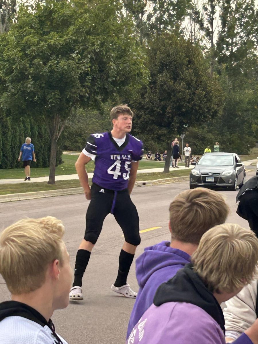Senior Colton Benson hyping everybody up at the start of the Homecoming parade before heading to the High School to face Worthington in the big game.
