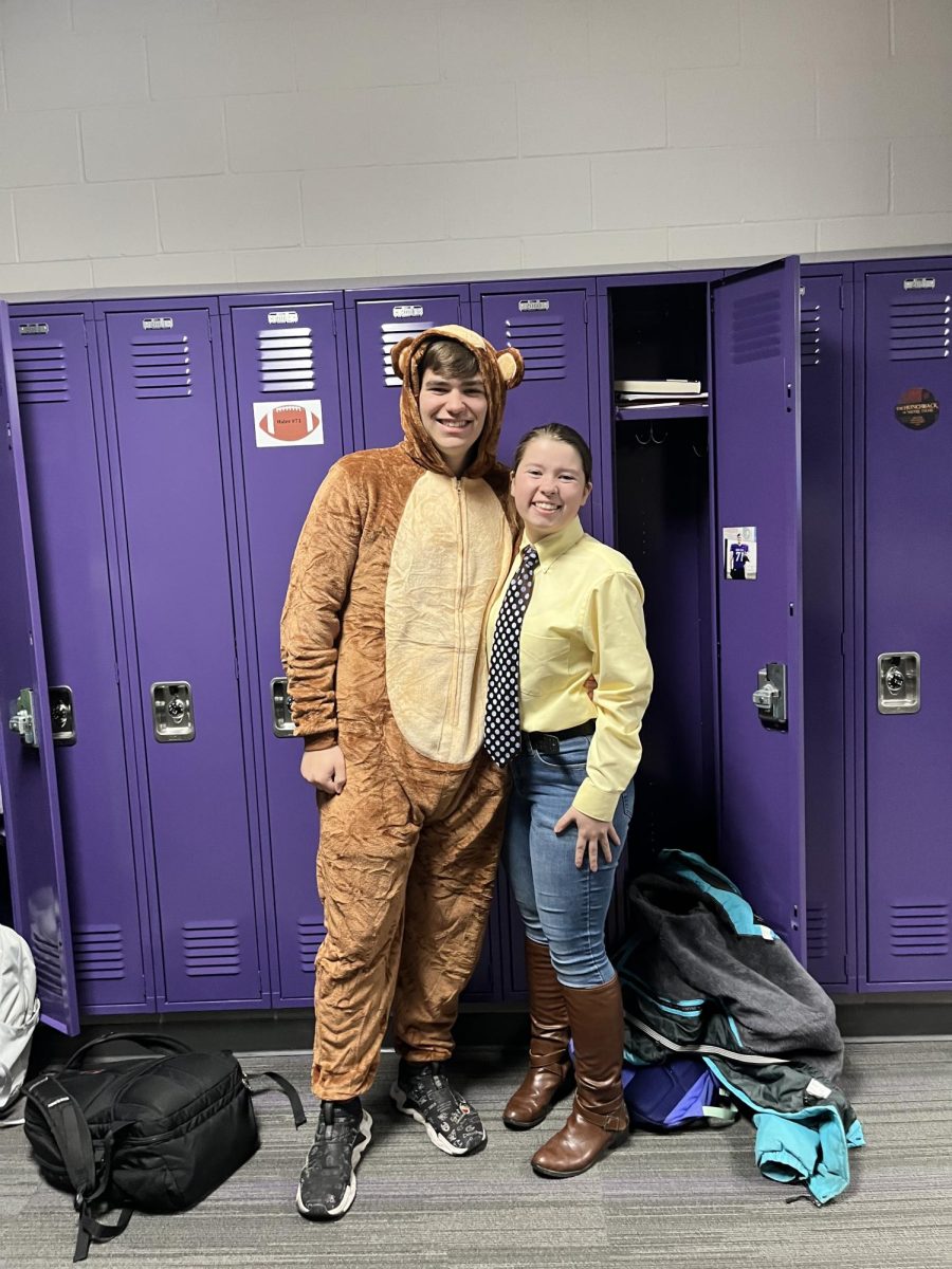 Students John Haler (left) and Jaden Jay dressed up as Curious George and the Man with the Yellow Hat.