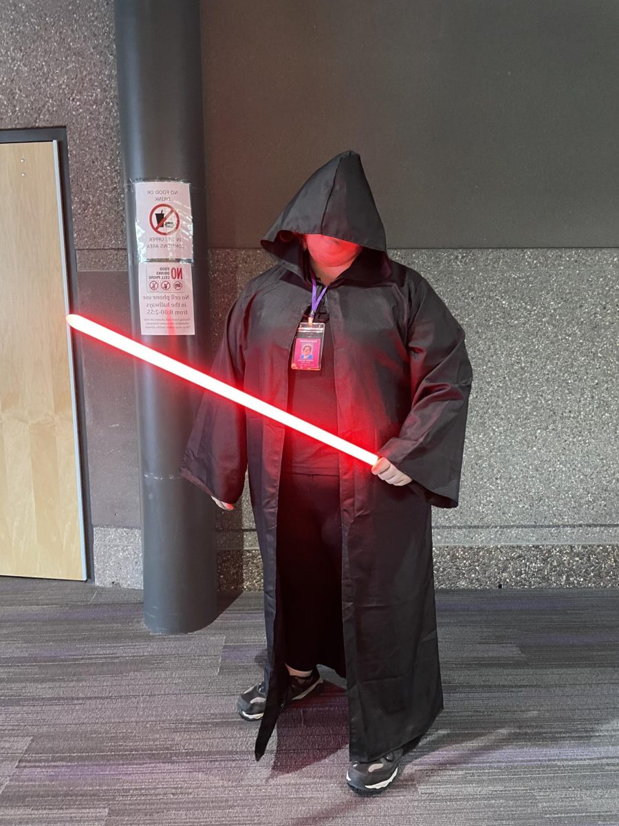 Senior Gabe Norway is dressed up as the Jedi from Star Wars for Halloween. 