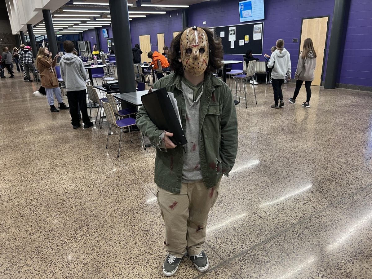 Junior Jason Malcolm stands alone dressed up as Jason from Texas Chainsaw Massacre. 