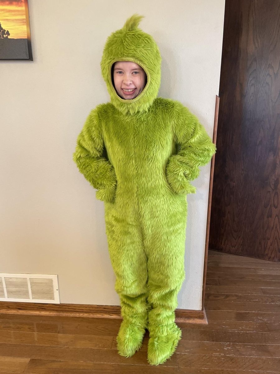 Senior Jenna Jay dresses up as the grinch for halloween. 