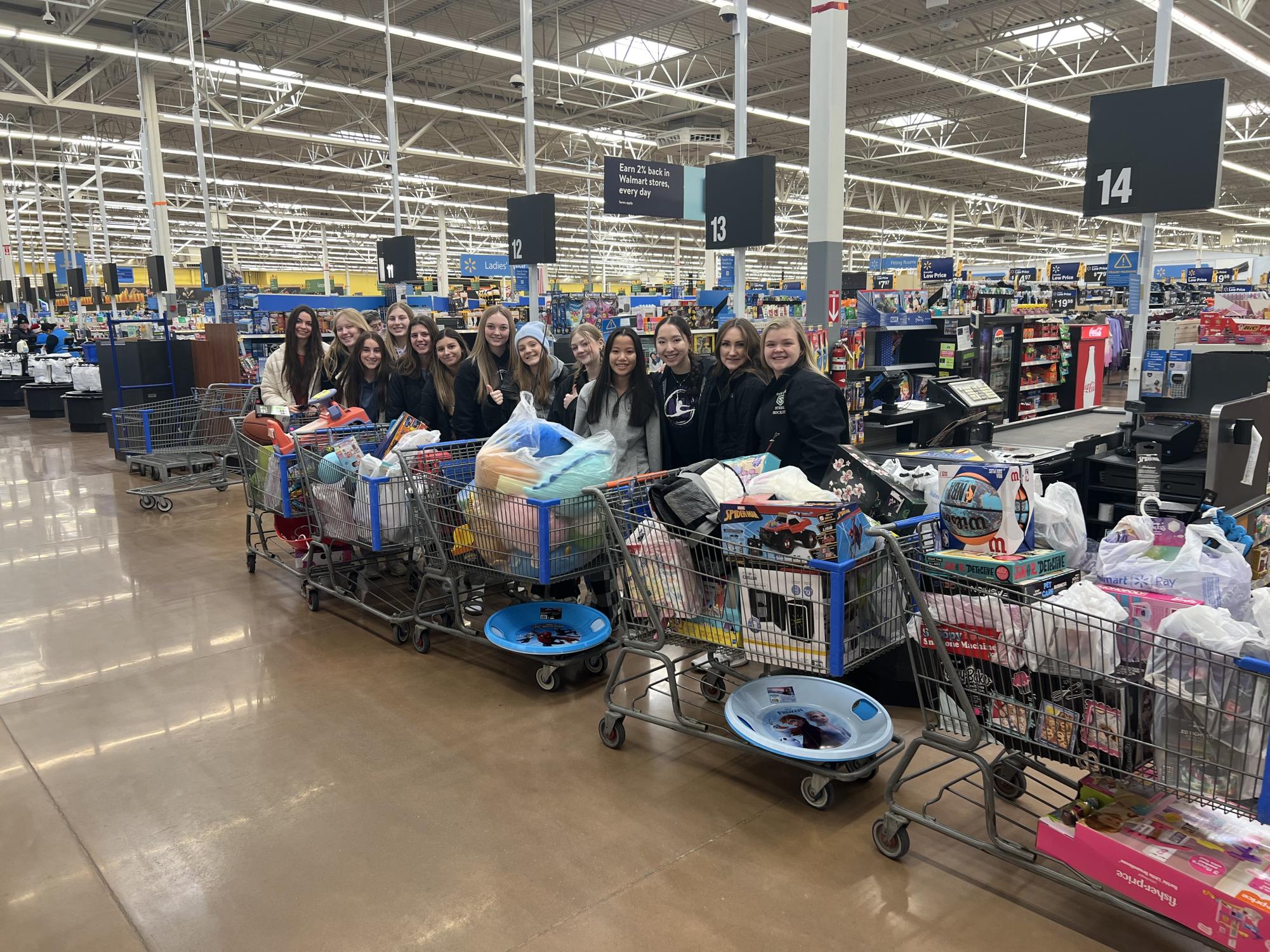 New Ulm FCCLA with their five shopping carts overflowing with toys for children in need. 