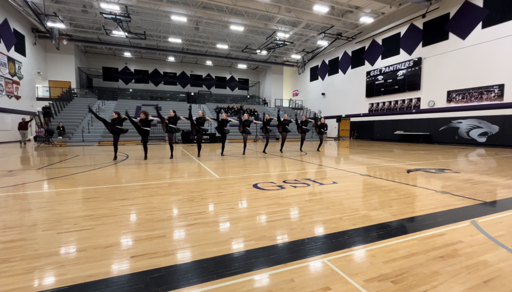 The NUHS dance team kicks to new heights during a competition at Glencoe-Silver Lake High School.