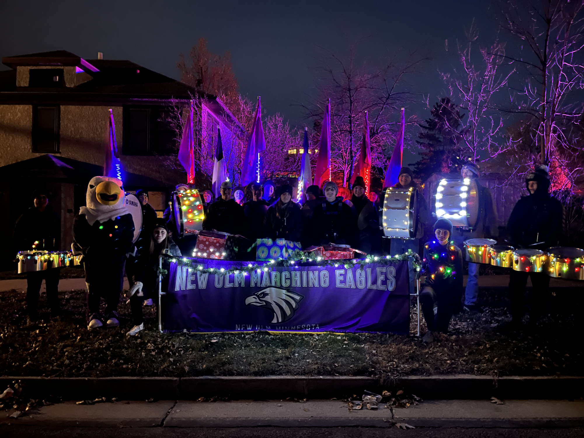 Drum line light up the winter parade as they march their way through