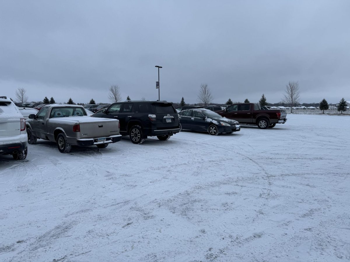 First day of a snowfall, will people be able to park properly or sloppy? Here is a few students trying there hardest to park normally without seeing the lines.