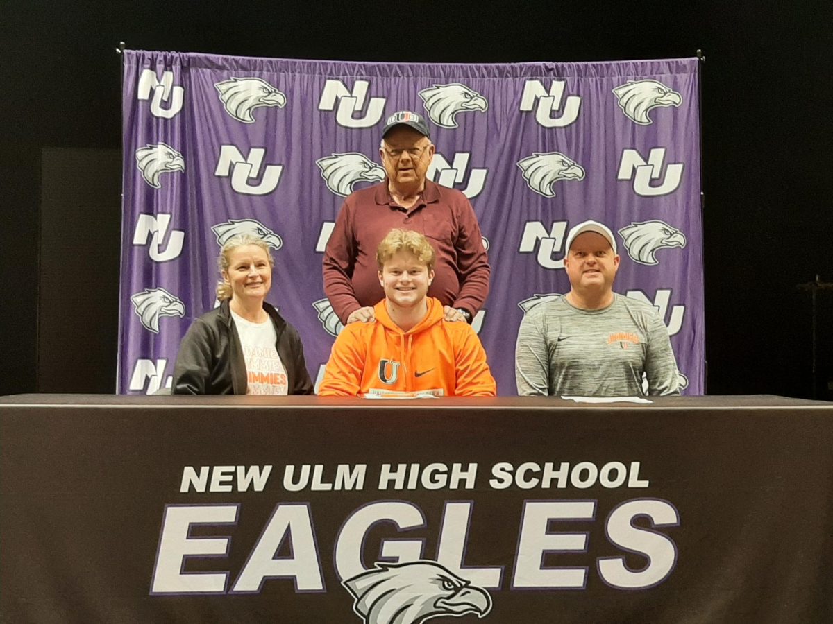 Ethan Lieb takes a photo with his family shortly after signing.