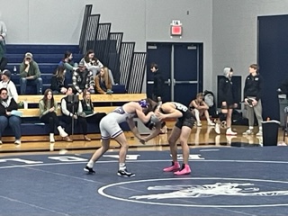 Sophomore Tegan Kral is facing one of his opponents from Holdingford   