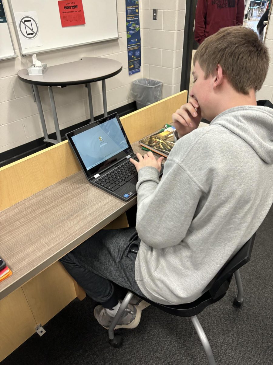 Senior Ethan Neet logging on to work on his Food Truck, Neets Meats.