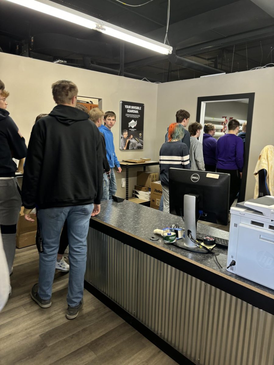 Students touring the Fuel Graphics building