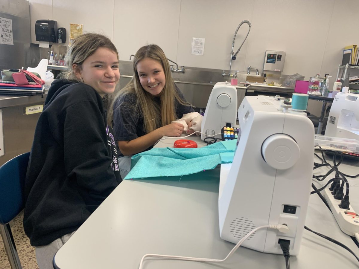 Juniors Natalie Sammons and Noelle Hauge working on their pillow case. 