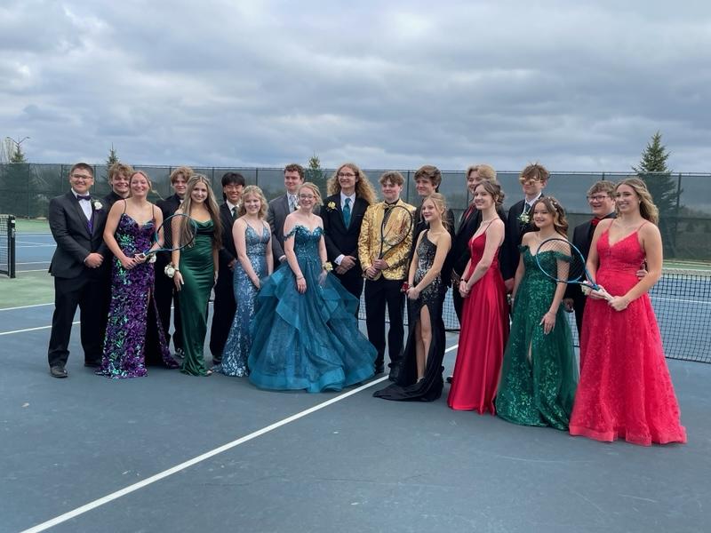 Tennis boys and their prom dates.