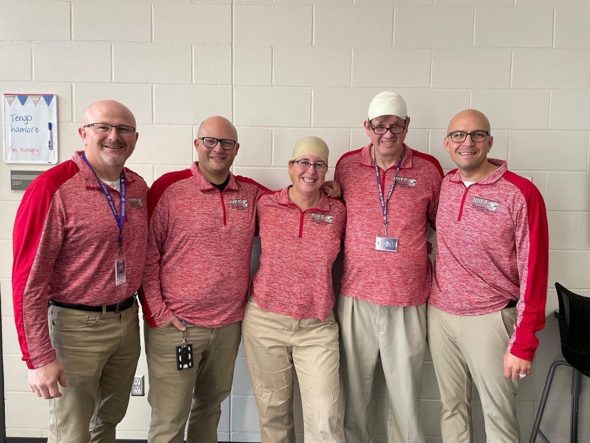 Mr. Bute, Mr. Nessler, Mrs. Gordon, Mr. Janssen, and Mr. Dennis matching, bald heads and all. 