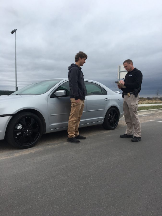 SRO Brehmer staging a ticketing of Brady Asmus