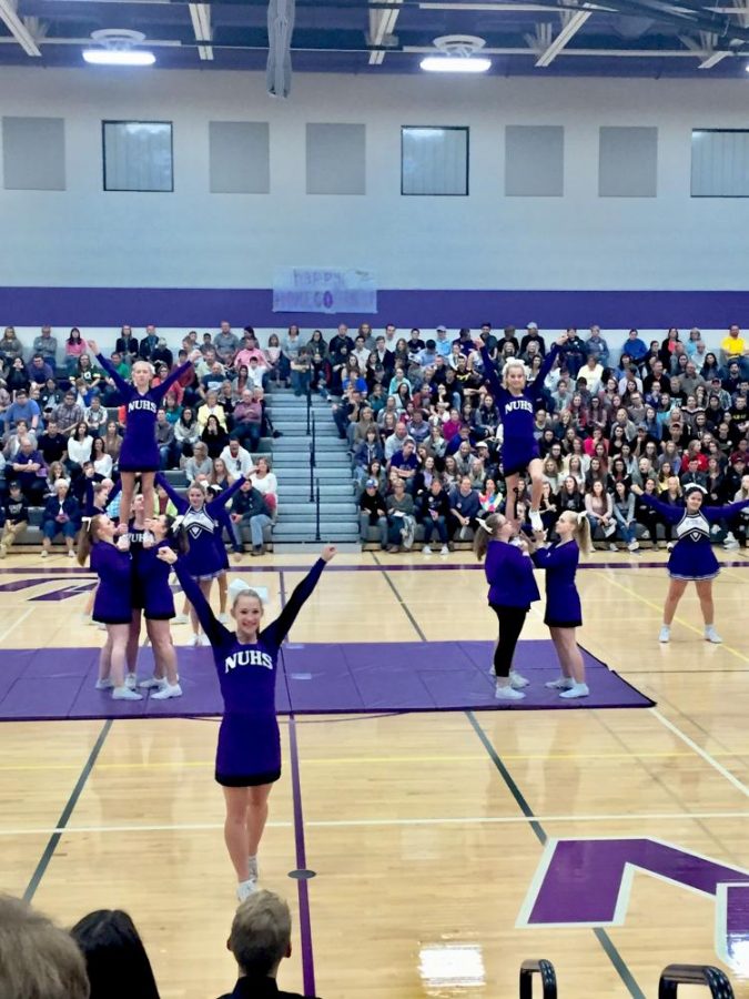 Our cheer team doing some wicked stunts during Homecoming Week!