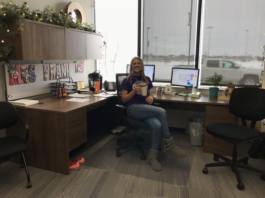 Mrs. Frank sits in her cozy office drinking coffee.