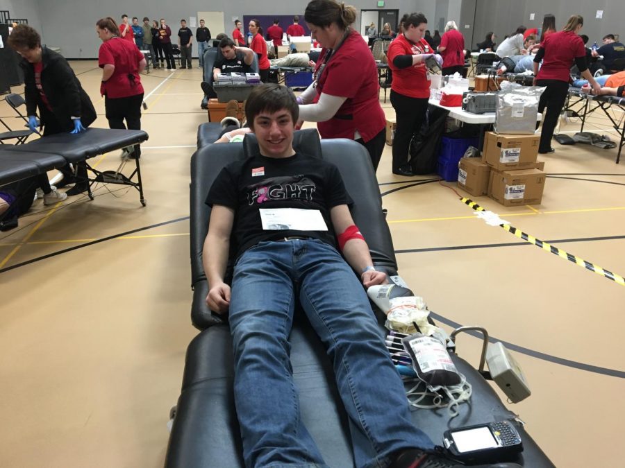 GIVIN' BLOOD. Junior Jaden Domeier participates in the New Ulm Blood Drive. 