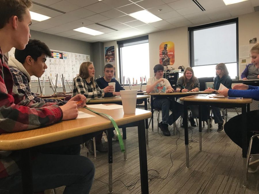 Seniors Emma Maudal and Peter Spengler, middle, have been known to know their fair share of answers to Knowledge Bowl questions.