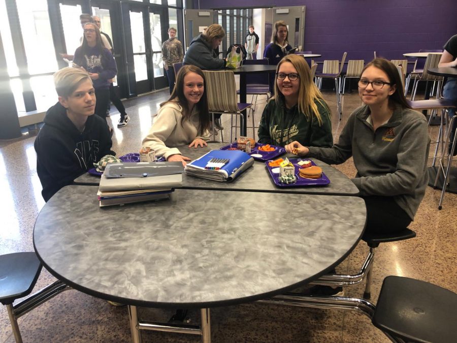 Four freshman enjoying their lunch together.