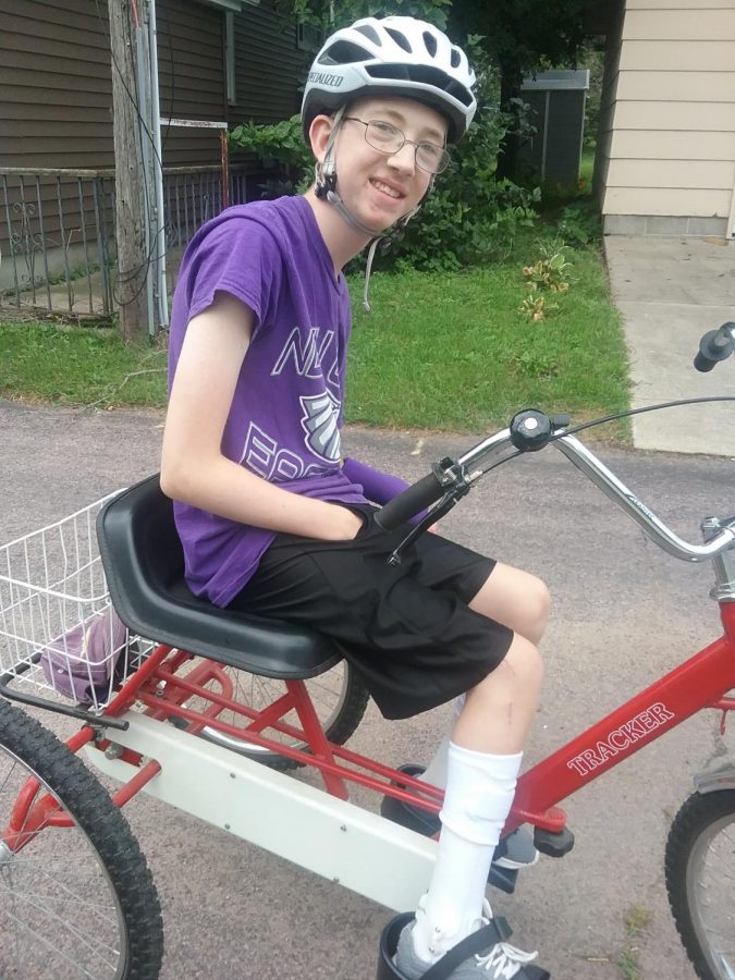 Distant learner working on  his daily task,Adam is working on biking which is a activity he chose for the day.