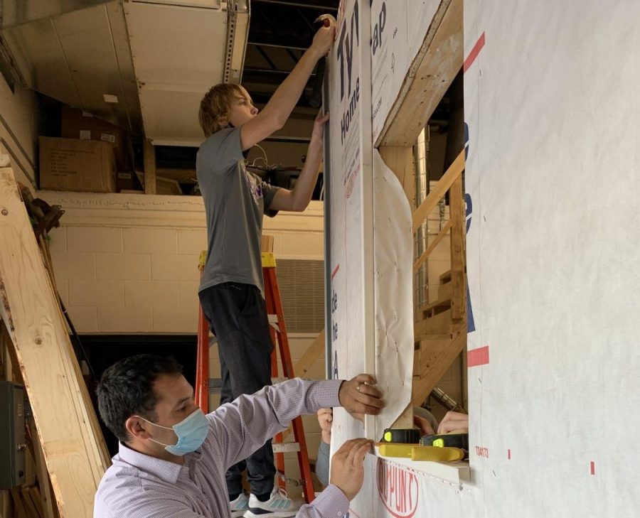 Mr. Briggs and students work on the start of what will be a fully vinyl sided wall. The Intro to Trades class explored many jobs over the semester. Some of these occupations include large equipment operators, plumbers, roofers, carpenters, and electricians. Mr. Briggs said, "With this being the first year of this class and having no curriculum to go off of, I think the students are gaining a wide range of knowledge for many, many potential jobs that do not require college degrees."