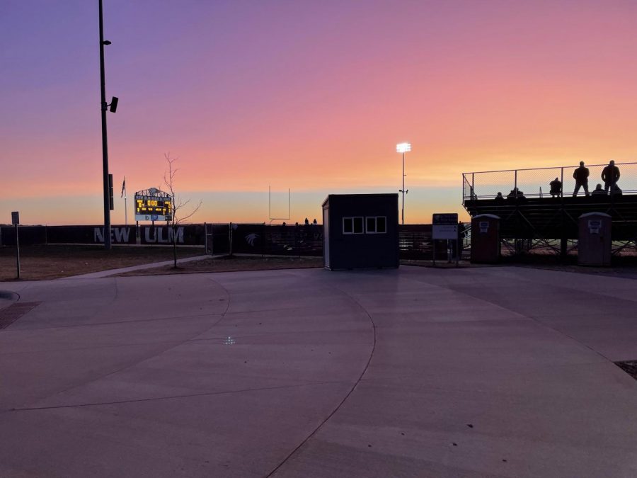 A beautiful sunset to leave the school for the day, with New Ulm C squad football team winning in the back. 