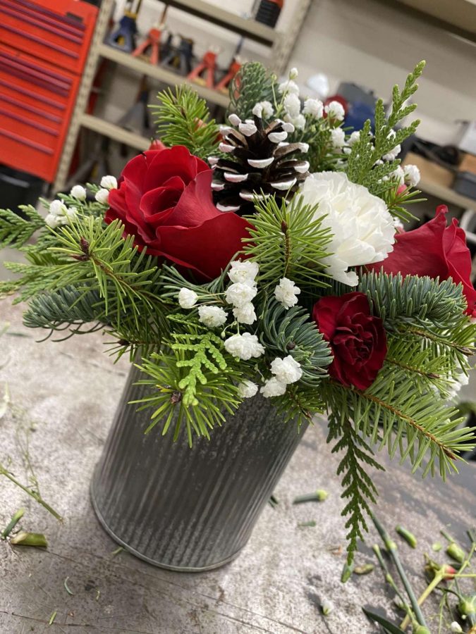 New Ulm High School Eagle Enterprise Class makes flower arrangements for Christmas.