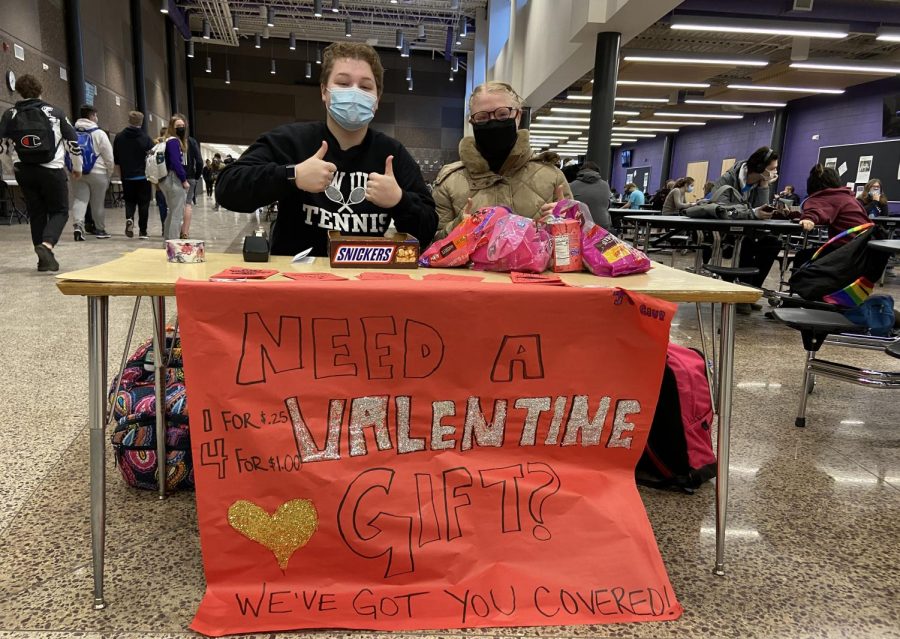 Two juniors, Katie Wilker and Alexis Peterson, selling valentines at the front doors of the high school for students to send sweet surprises on Tuesday, February 10, 2021. 