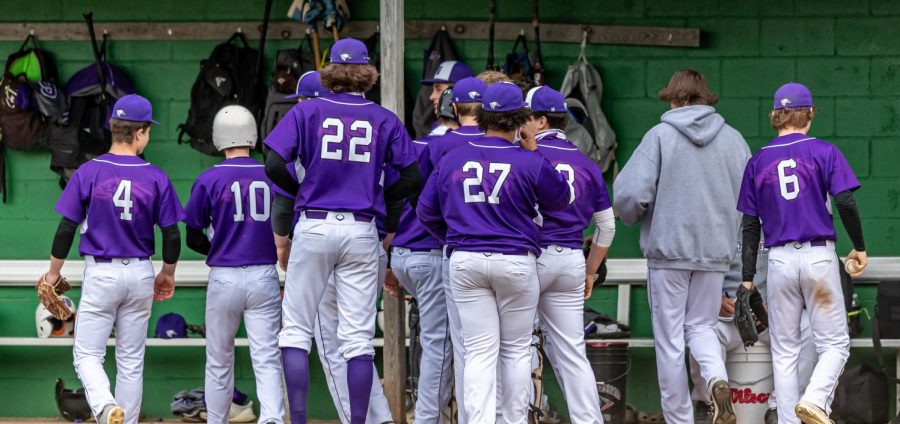 The Eagle's Baseball team walking into the dugout after a run was scored. 