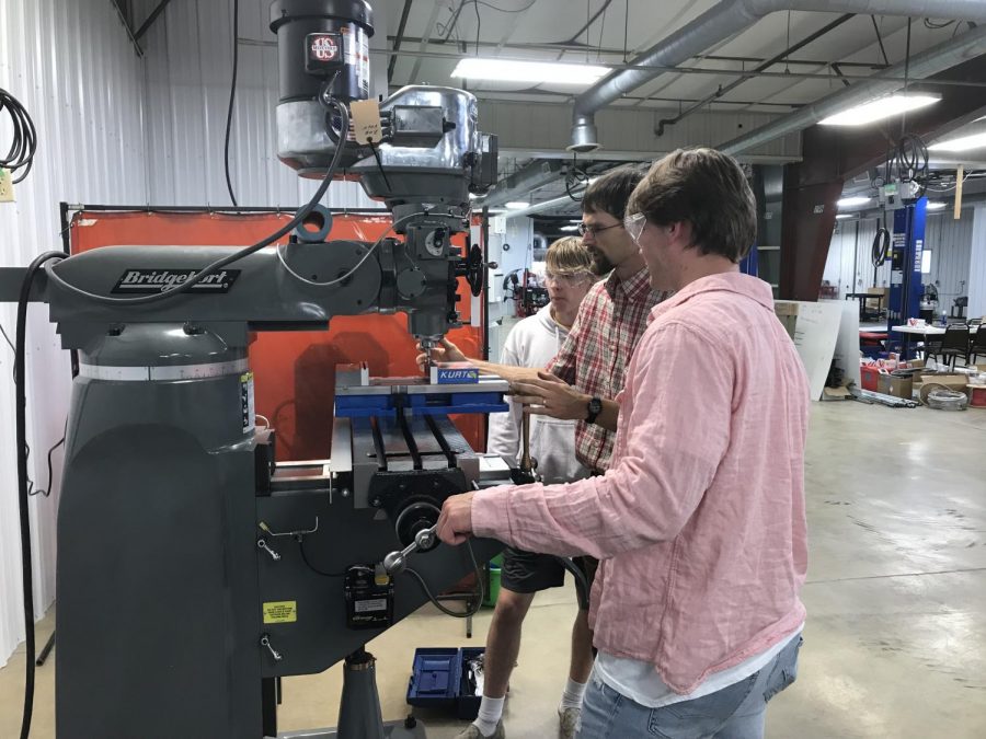 Down at the C.T.E. center recently, shop teacher Lindsey Johnson shows students how to properly zero in on an edge on one of the new mills the school has acquired. "The goal is to teach the students how to operate these machines independently and effectively so they can hopefully use this skill in the work force someday," Johnson said.  