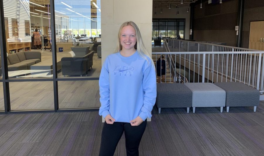 Junior Brenna Thordson shows off one of her custom embroidered crewnecks. In May 2021, Thordson began selling her crewnecks on an Instagram account dedicated to her small business: @btdesigns04. On her page, she displays photos of her past projects for potential customers to view and buy. Thordson did not go into the embroidery business only for the money, though: "I started my small business because I have always loved to create and once I made some [crewnecks] for myself, other people were interested so I started selling some to my friends," Thordson said. From there, her business grew, and almost four months later, she is shipping her products all around Minnesota.