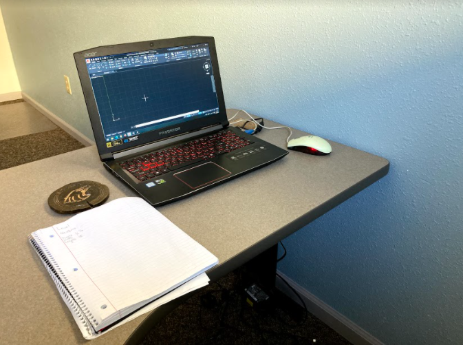 Senior Anthony Gonzalez is learning CAD in the Eagle Enterprise-class without any assistance from high school teachers. Gonzalez said, "I feel like I was able to achieve something that is beyond average school knowledge." 