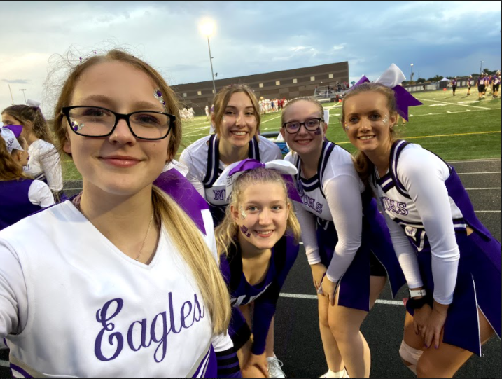 The New Ulm senior high senior cheerleaders prepared for their last homecoming game cheering on the New Ulm high school football players againt Fairmont high school.