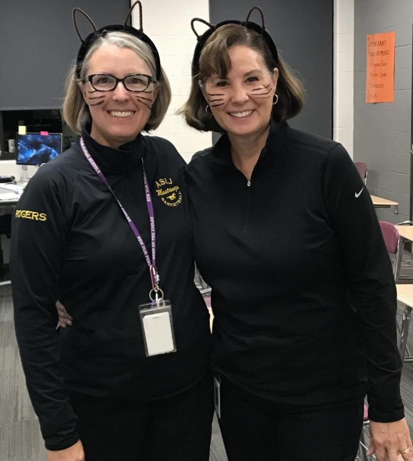 Ms. Cowing and Ms. Rogers kick off Halloween as cats. 