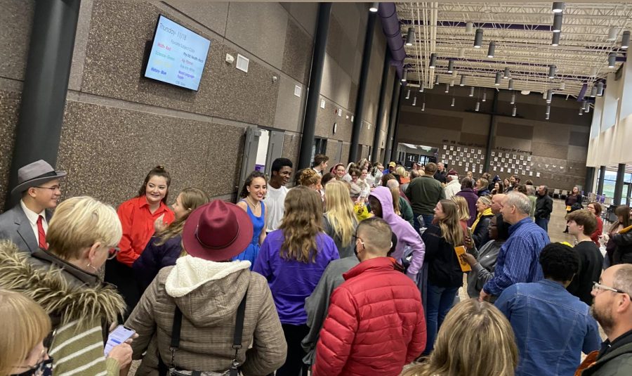 Cast members of the musical Bye Bye Birdie meet with the audience in the high school commons after their final performance