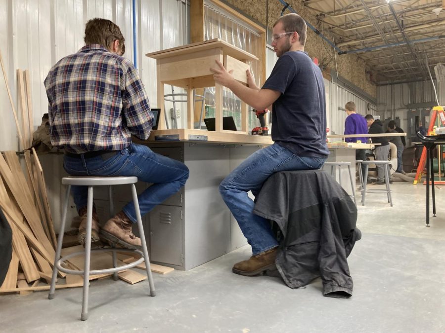 Seniors Tyler Sondag and Landon Beck working on advanced woods projects.