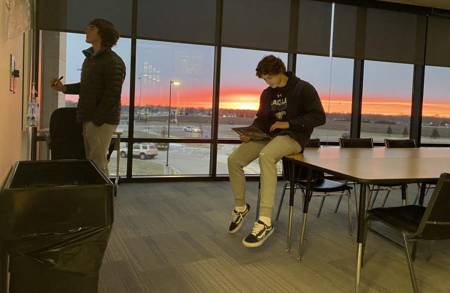Eagle Online students Josh Gulden and Braxten Hoffmann fine tuning a journalism story at sunrise one recent morning