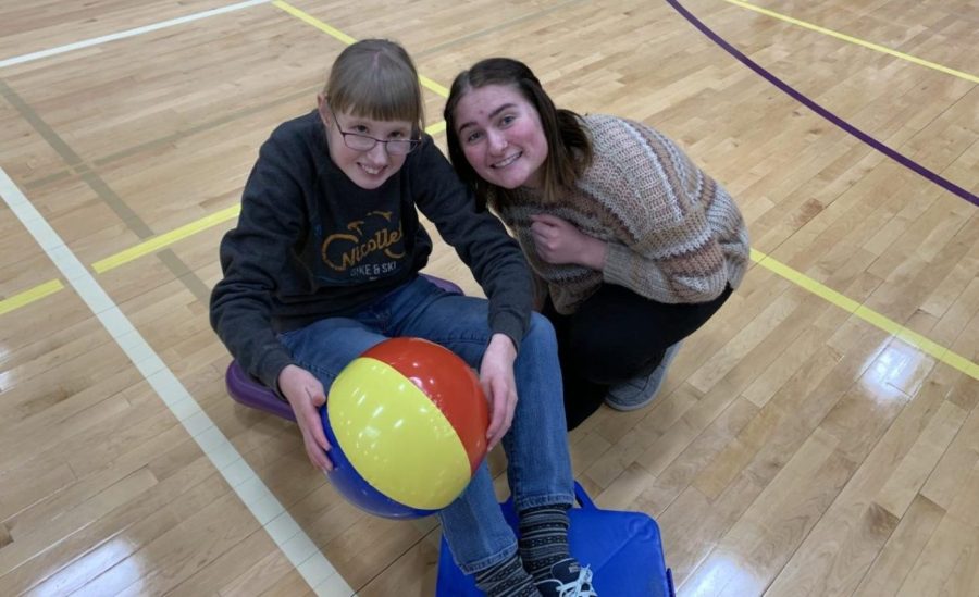 On Friday, Senior Maddie Nelson (Right) worked with Sophmore Grace Julien (Left) to improve hand-eye coordination skills through playing beach volleyball in PEOPEL Aide. 