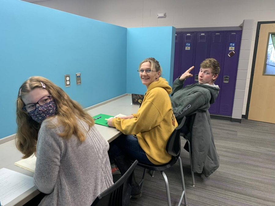 Para Miss Jen, was found in the English hallway helping seniors; Jacob Vogel and Kaitlyn Braulick with reading a book. 