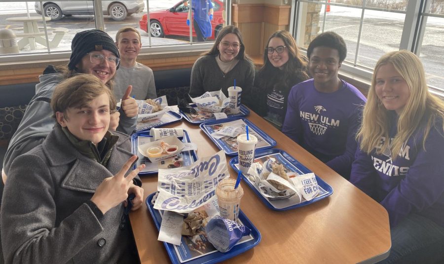 A group of knowledge bowl students (right three) and NUHS alumni (left four) enjoying lunch together at Culver's in Mankato this Friday after team purple wins their second #1 this season. "I am very very proud. As usual we expected the most out of them and they delivered, so good to them," says Marcarious Amoah(right), who plays on team maroon.