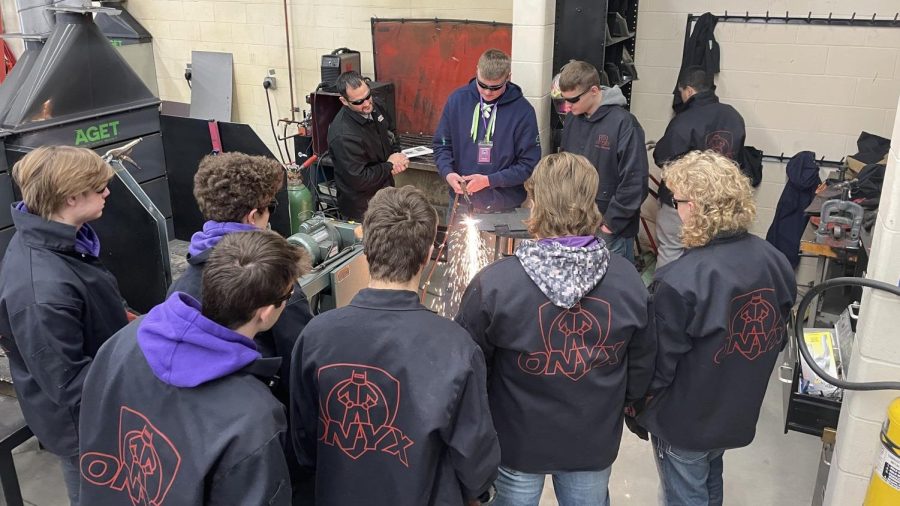 In the NUHS welding shop on Thursday, Feb. 3 advanced welder Jarrett Platz demonstrates how to use an oxy-acetylene torch to cut material for the intro to welding class. " The purpose of intro to welding is so kids can get familiar with the different welding processes. In the future go on to take advanced welding or eagle enterprise down at the CTE center." Ag instructor Ms. Brandt said. The intro to welding class is learning and understanding how to use an oxy- acetylene torch so they would be able to use this skill in the future.