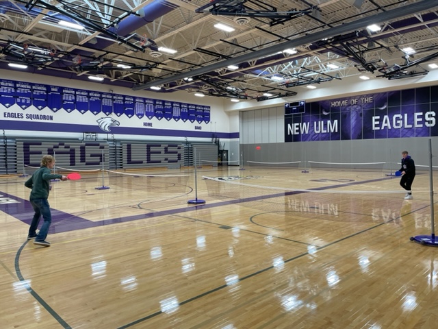 Gym classes at New Ulm High School, taught by the physical education teacher and strength coach Derek Lieser, learn and practice a variety of different sports in class. Since the beginning of the spring semester, they have been in the pickleball unit. "Anyone can play the sport," Lieser said. "The game is easy and fun to learn." Continuing these fun and easy to learn games will excite kids in school to participate in gym class and possibly develop a hobby. 