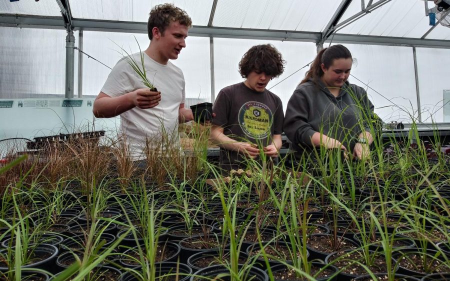 The Dusty Miller Crew&#x2122; going above and beyond on the extensive labor of planting grass for horticulture class. Pictured left to right are, James McGuire, Zennon Smith, and Sarah Massey.