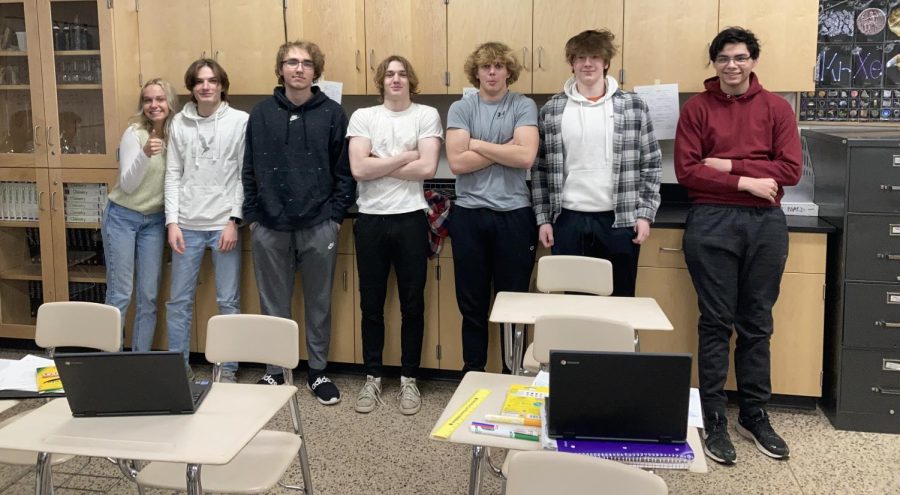 Deegan Tauer (second from right) and a few other students from the investigating chemistry class posing for a photo.