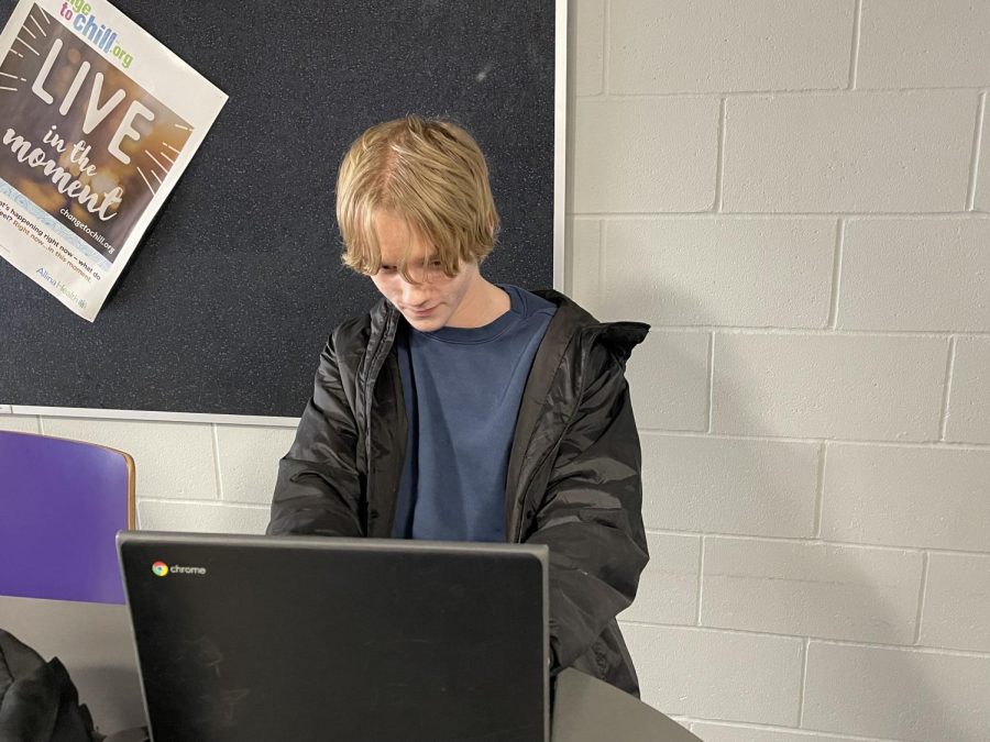 Junior Shaun Moldan signs up for classes for his Senior year in the math wing after school