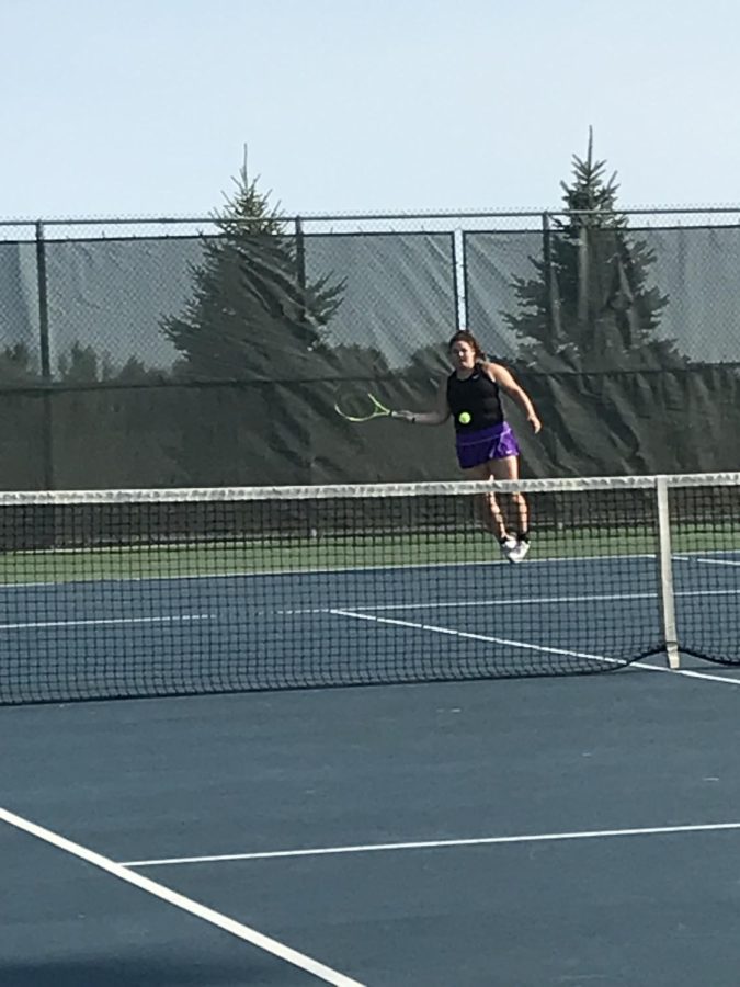 Sophomore Jocelyn Petterson recently playing in a varsity tennis match vs. the Saint Peter Saints at New Ulm High School. "Singles is a lot more running because rallys go longer" Jocelyn said. In  a varsity tennis meet there are 7 matches played, 4 singles, 3 doubles.