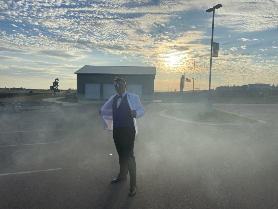 Jared Beranek posing in the smoke dressed up for NUHS homecoming court Monday  afternoon.