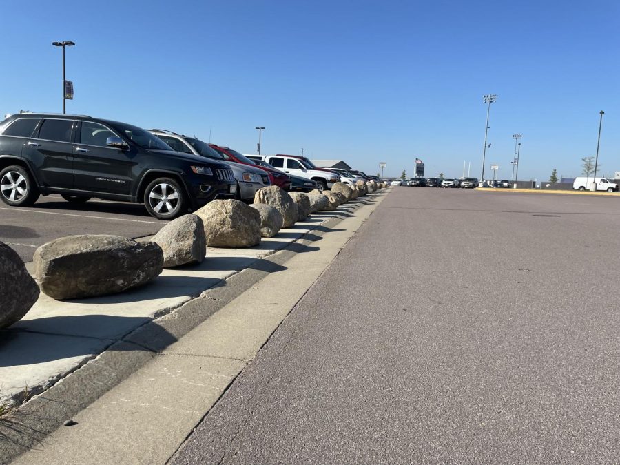 At the beginning of the school year, students noticed a line of rocks blocking the curb in the parking lot. While there was outrage from students, the school put them there with good reason. Over the last few years students driving over the curb have caused problems for buses trying to back out at the end of the day. Mr. Bergmann emphasized that this isn't a punishment but a reminder that "the laws don't end at our doors," and would appreciate if students would consider this when driving around the parking lot to prevent accidents that may require more action to be taken.