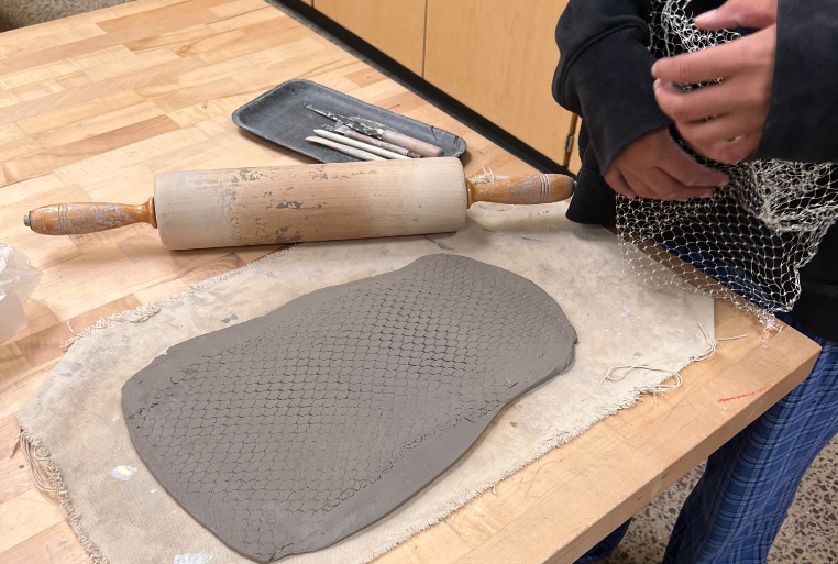 Senior Gloria Foucher makes a clay tray in Ms. Page's 2nd hour Pottery and Sculpture class. "I'm very eager to see all the things we'll be making this semester," said Foucher. This is the students' second project moving into the new school year.